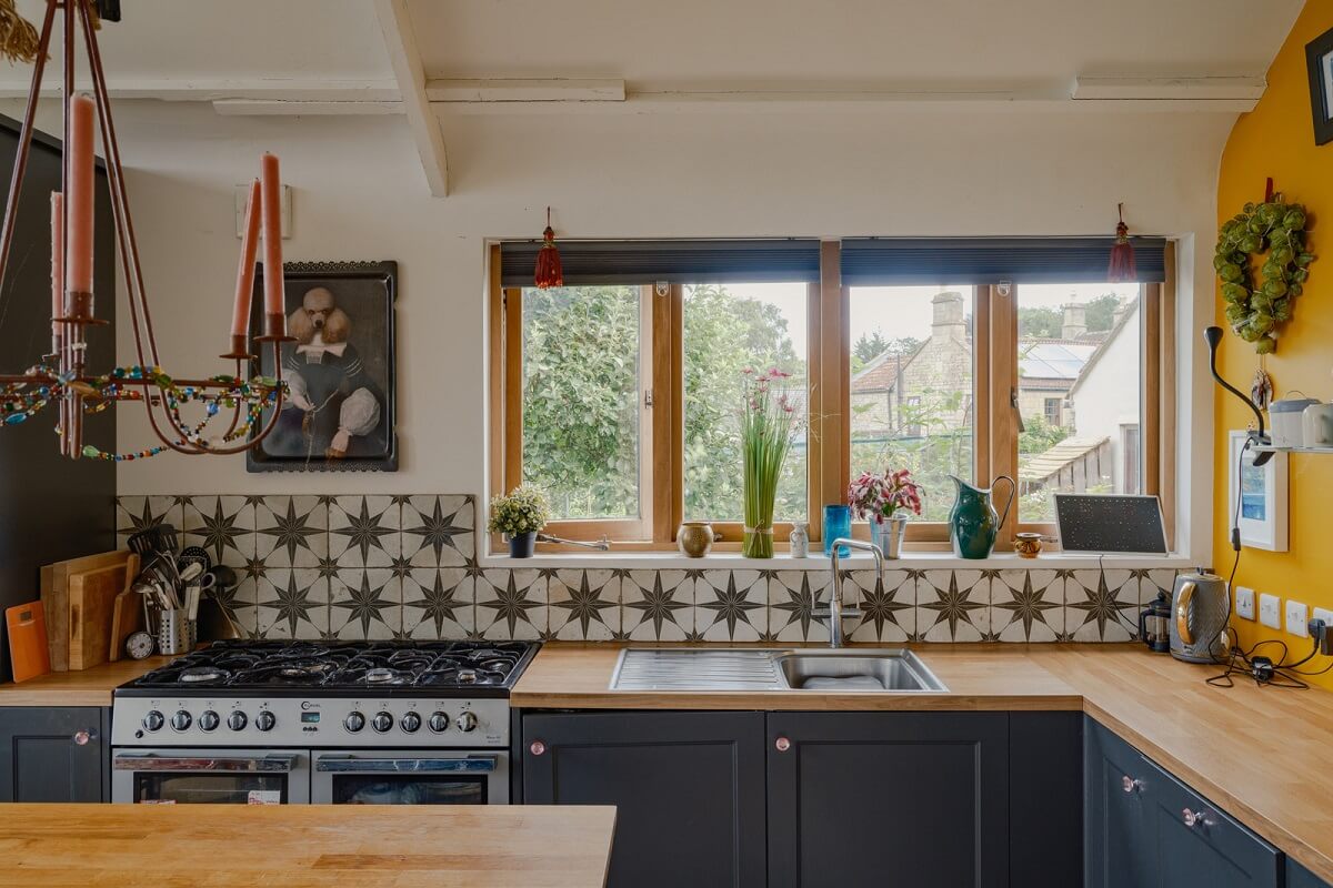 A Black Barn House with Boho Interiors and Breathtaking Views 6 kitchen star tiles yellow wall