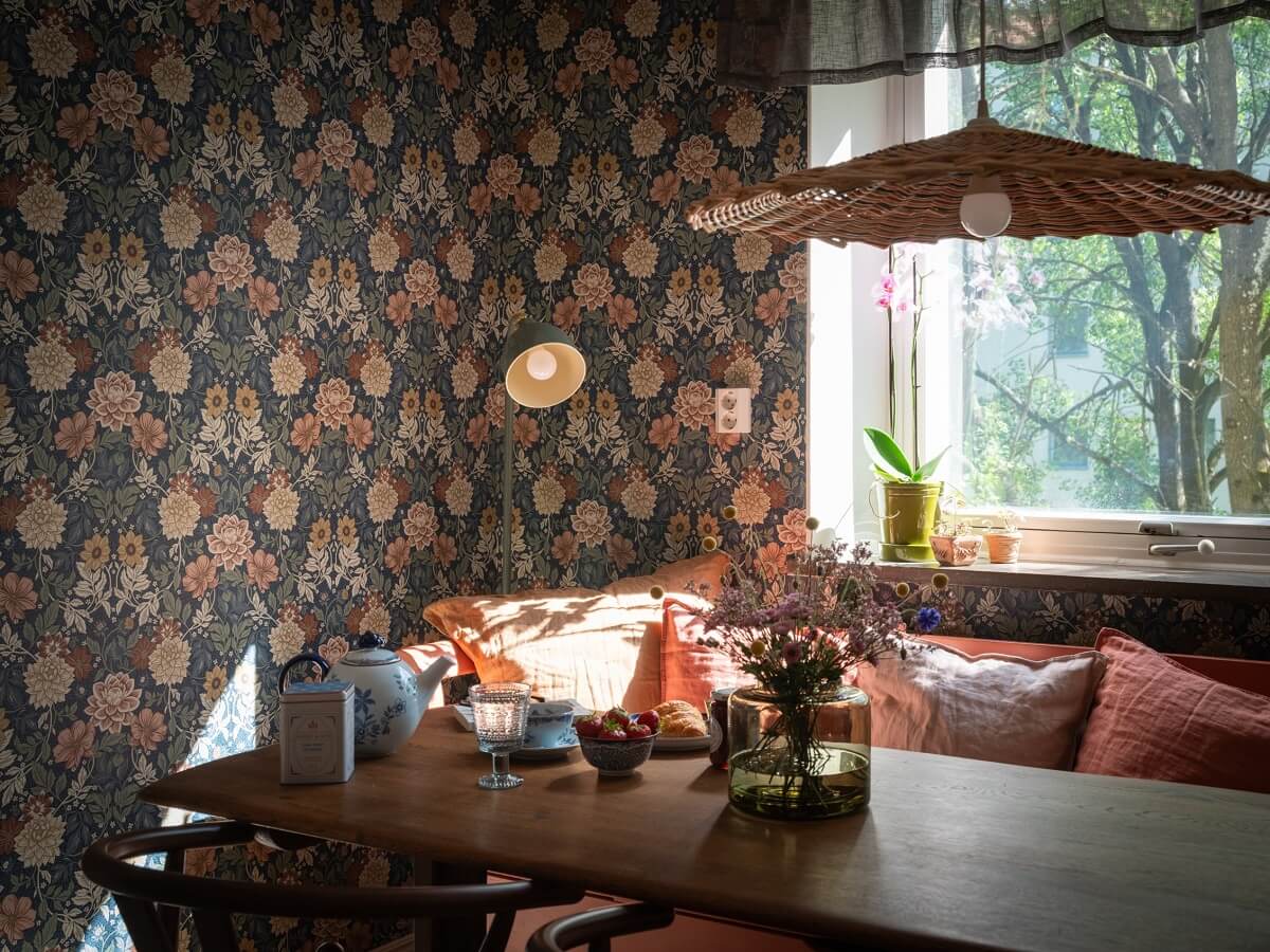 Floral Wallpaper and a Pink Kitchen in a Midcentury Apartment 15 kitchen table with bench and floral wallpaper