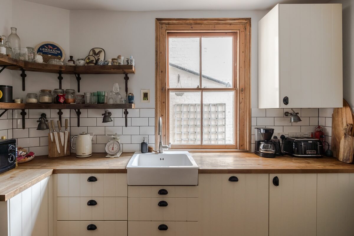 Pared-Back Interiors in a Late Victorian House 8 kitchen with butler sink shelves