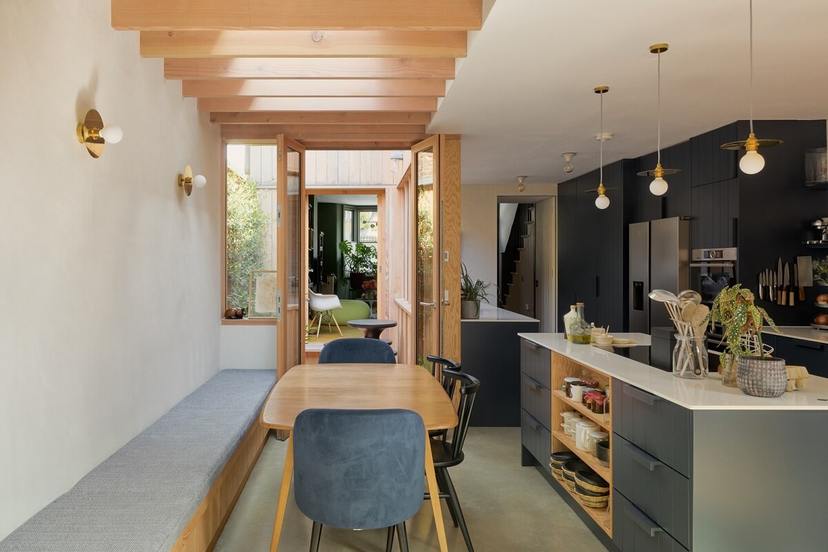 Douglas Fir and Natural Materials in a London Home 10 kitchen with dining space and built in bench