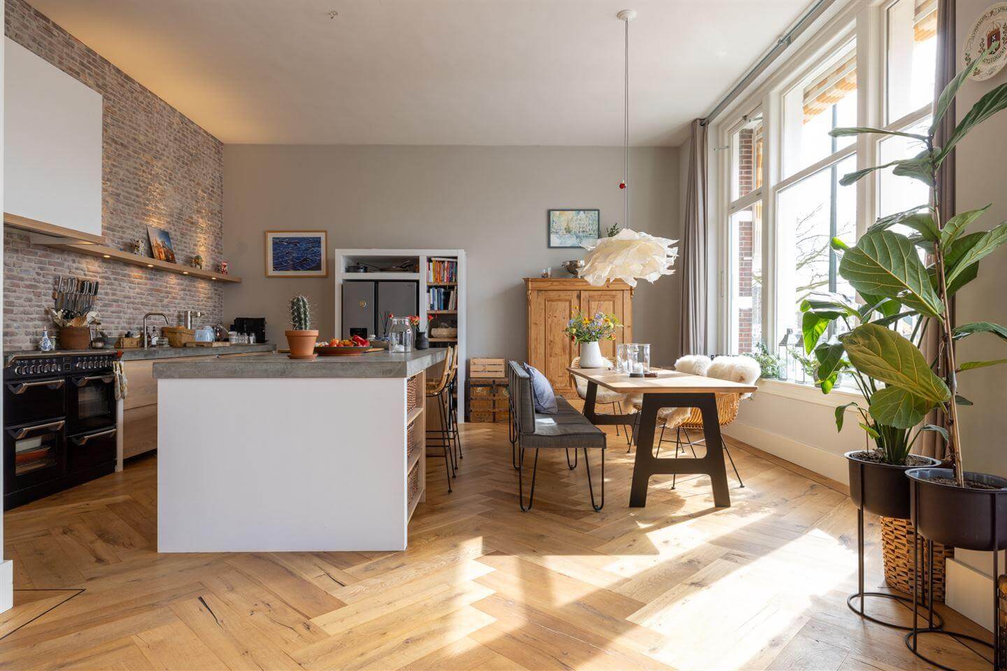 A Modern Duplex Apartment in The Netherlands 4 kitchen with island and brick wall
