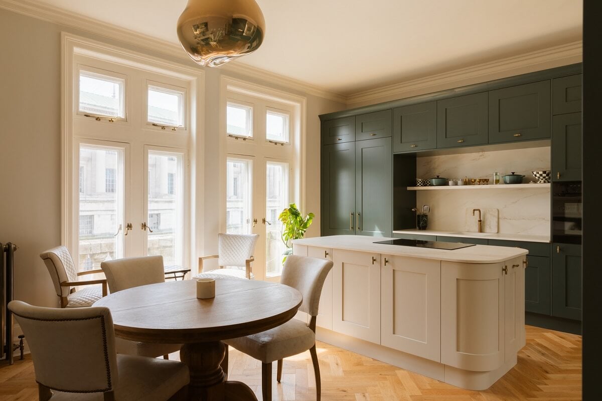 A Stylish Apartment in the Heart of London's Whitehall 7 kitchen with island and green cabinets