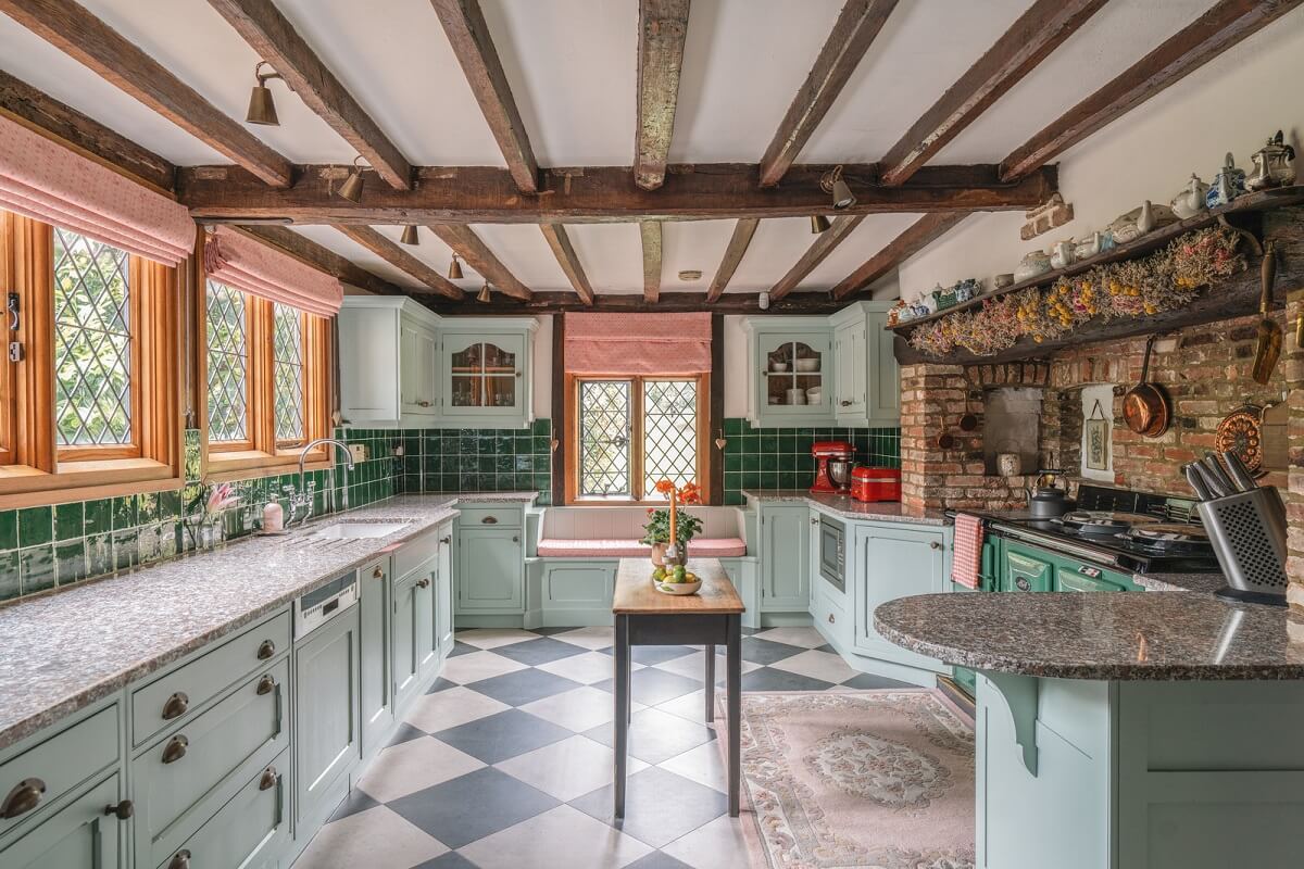 Magnificent Period Features in an English Tudor House 7 kitchen with mint green cabinets checkerboard floor green tiles and wooden beams nordroom