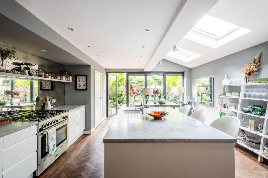 An Open Plan Victorian House with a Lush Green Garden 5 kitchen with skylight and island An Open Plan Victorian House with a Lush Green Garden