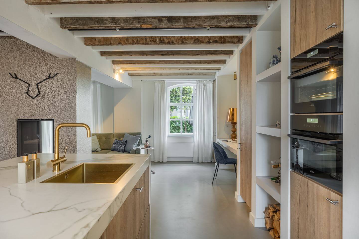 A Beautiful Loft Style Home in a Former Dutch Factory 3 kitchen with wooden ceiling beams