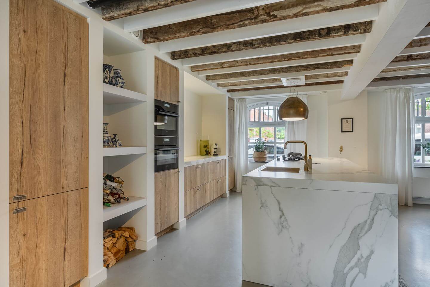 A Beautiful Loft Style Home in a Former Dutch Factory 4 kitchen wooden fronts marble island