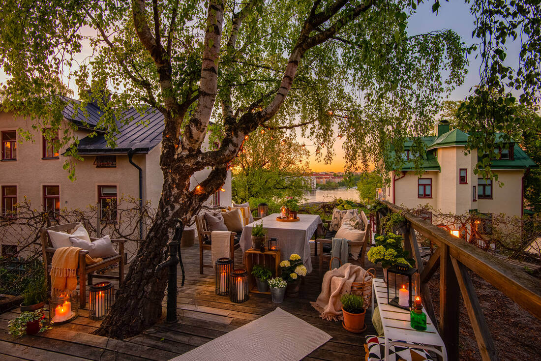 A White Apartment Features a Beautiful Terrace with a View 14 large terrace with tree and view sweden