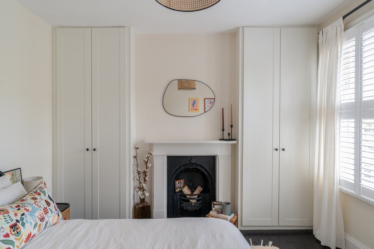 Blue Tones in a Two-Bedroom Victorian Cottage 11 light bedroom fireplace built in wardrobes