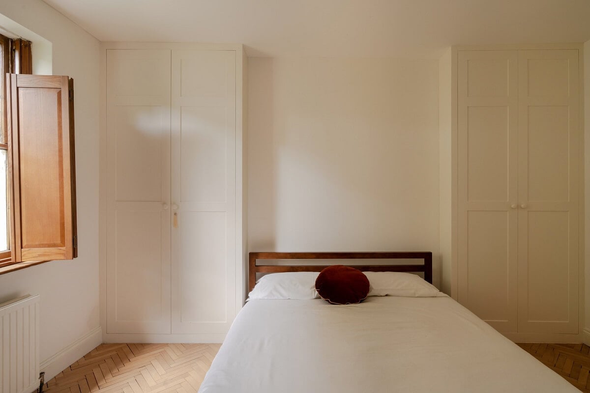Pared Back Interiors and Light-Filled Spaces in a London Apartment 10 light bedroom with built in wardrobes