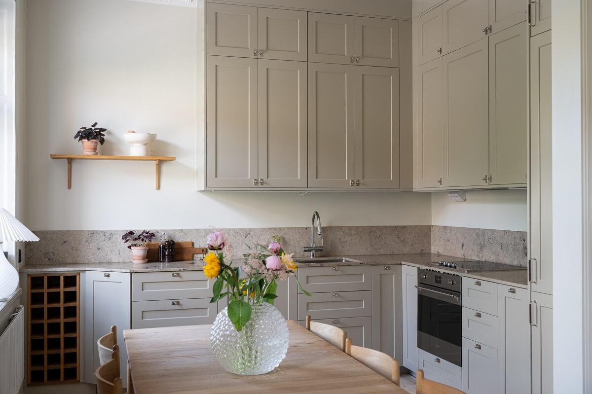 A Renovated Turn-of-the-Century Apartment with Two Bedrooms 9 light gray kitchen cabinets