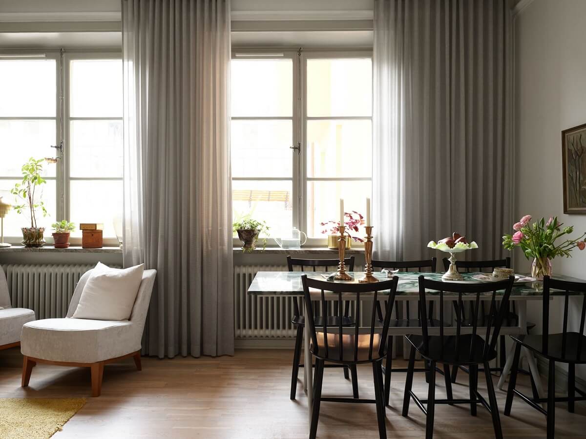 A Charming 1920s Apartment with a Green Bedroom 9 light gray living room with large windows