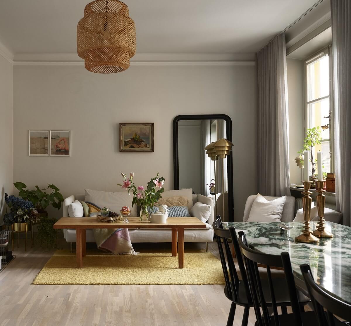 A Charming 1920s Apartment with a Green Bedroom 7 light gray living room with light yellow rug nordroom