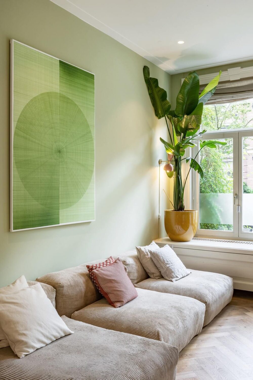 A Beautiful Renovated Duplex Apartment in Amsterdam 3 light green walls modern living room