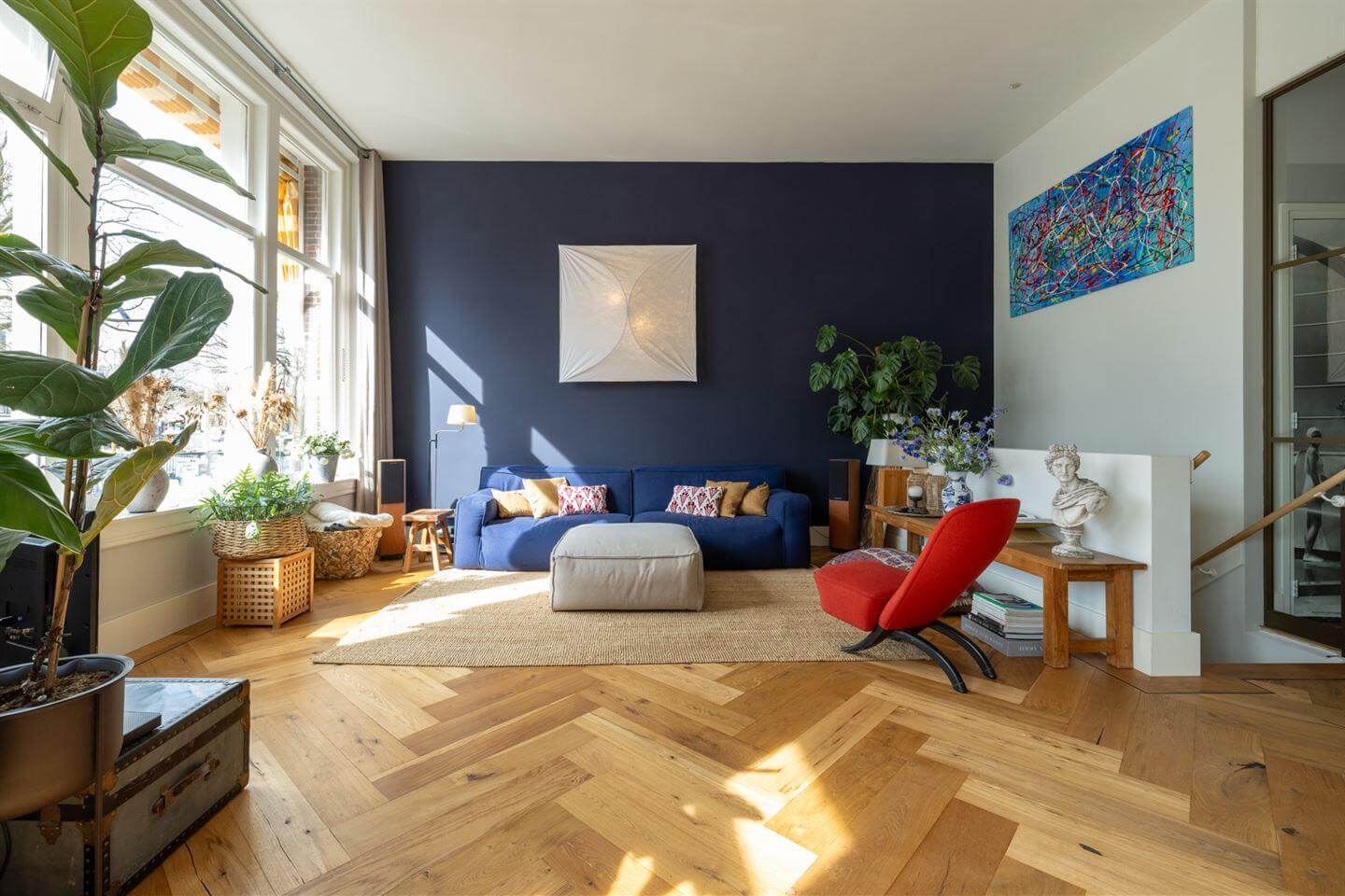 A Modern Duplex Apartment in The Netherlands 2 living room blue feature wall