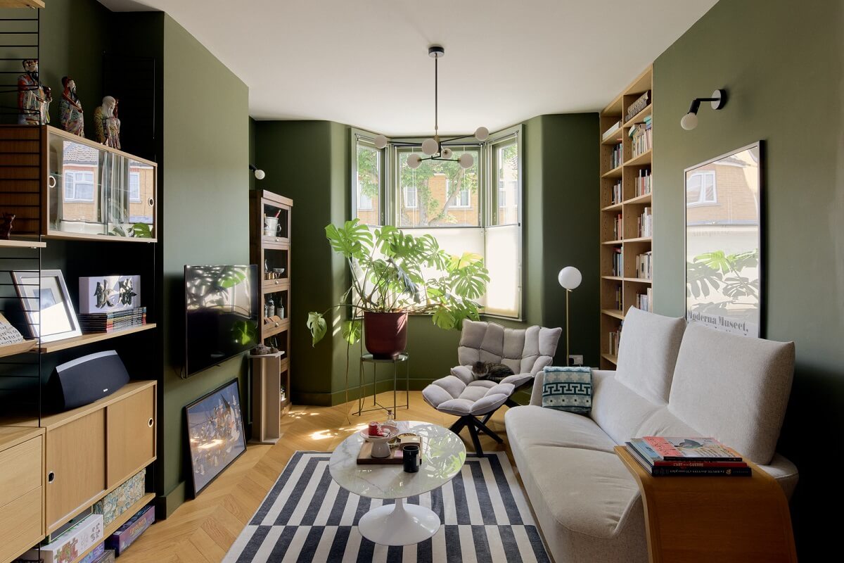 Douglas Fir and Natural Materials in a London Home 2 living room green walls and bay window