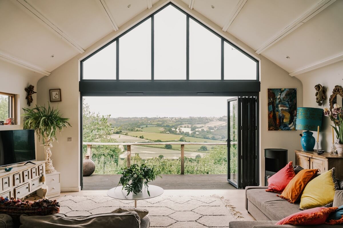 A Black Barn House with Boho Interiors and Breathtaking Views 4 living room pitched ceiling country views