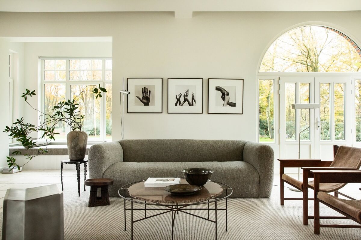 Historic Character and Timeless Elegant Interiors in a Restored Belgian Villa 4 living room with arched window and window seat nordroom