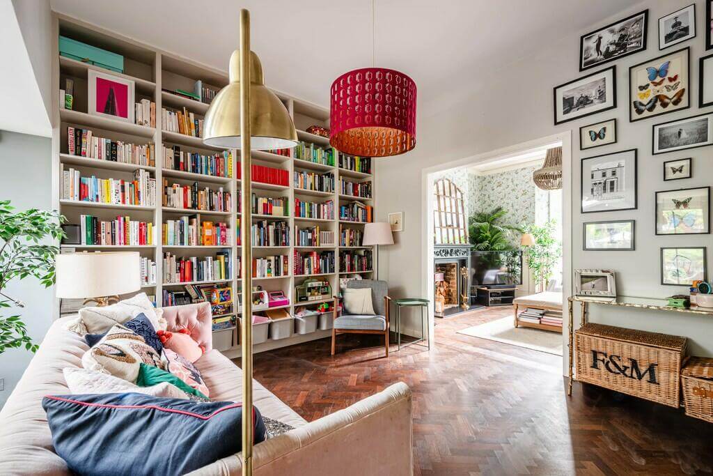 An Open Plan Victorian House with a Lush Green Garden 3 living room with bookcases An Open Plan Victorian House with a Lush Green Garden