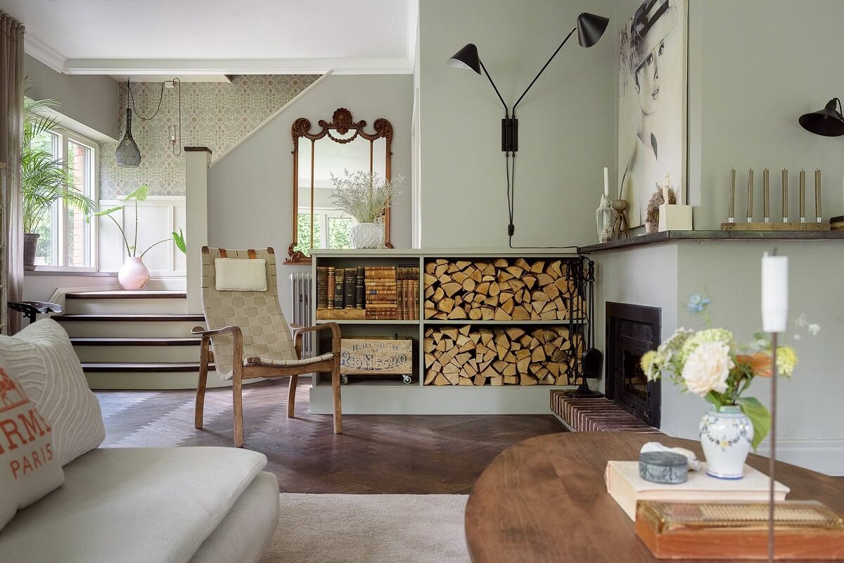 A Beautiful Family Home in a Grand 1930s Villa in Sweden 10 living room with fireplace and log storage nordroom