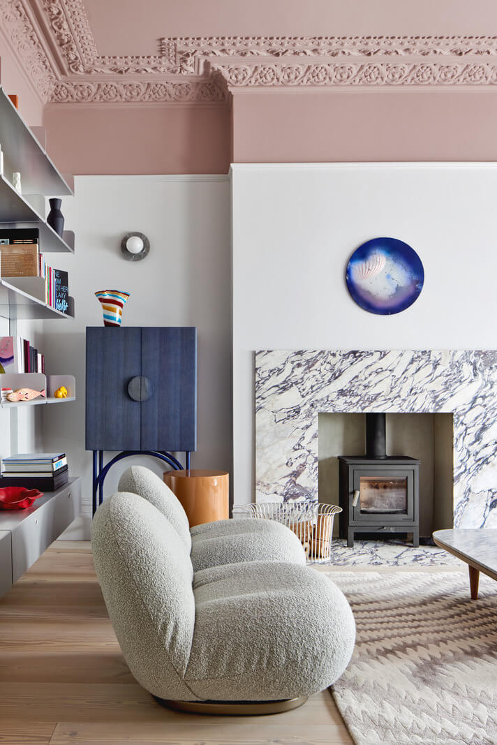 A London Family Home Decorated in Pastel Colors 3 living room with pastel pink ceiling and marble fireplace nordroom