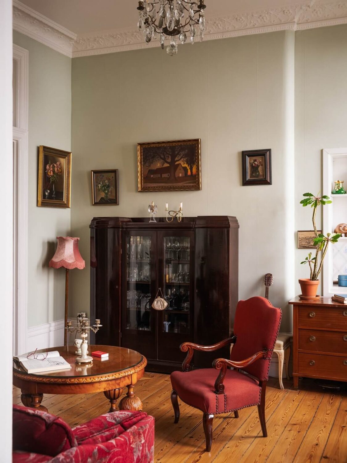 Antique Furniture and Arched Windows in a Stockholm Apartment 5 living room wooden floor antique furniture nordroom