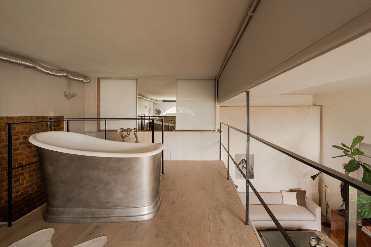 A London Loft in a Former Victorian School Building 7 loft bedroom with freestanding bath