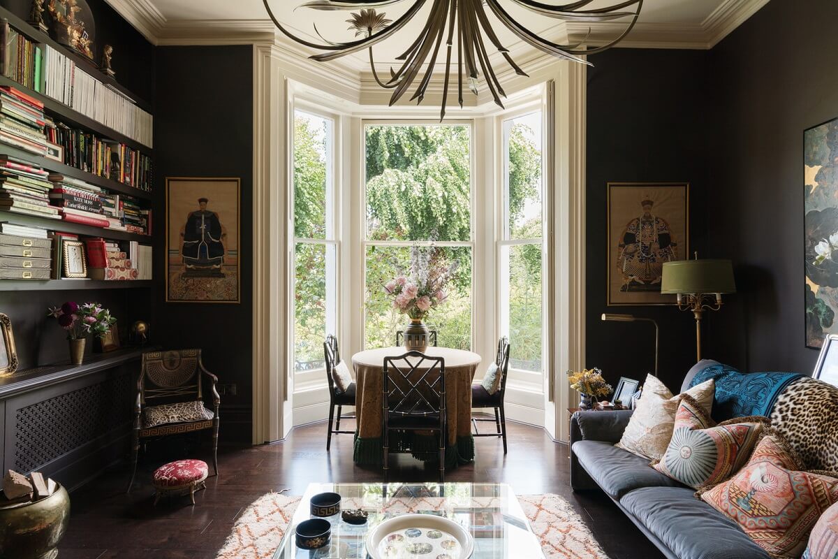 london apartment moody wall color bay window bookshelves nordroom