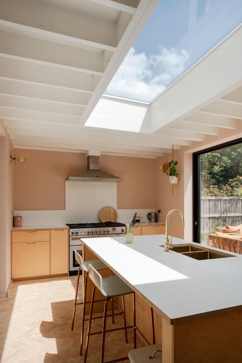 A Stunning Color Palette in an Extended Edwardian House in London 14 modern kitchen with skylight and pink walls nordroom
