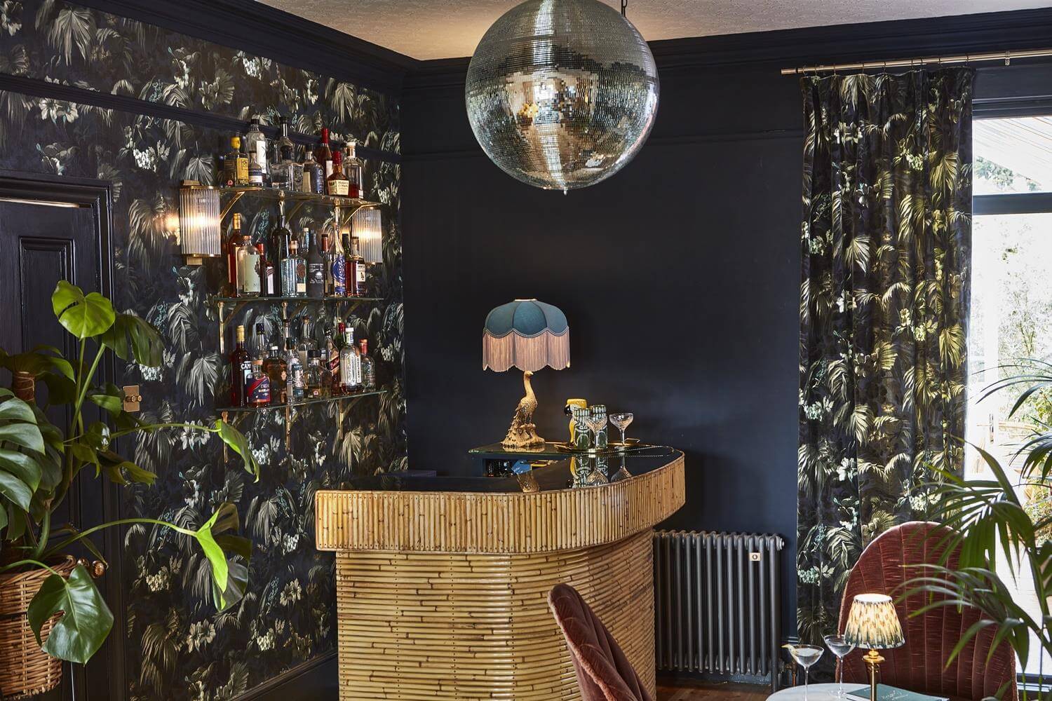 Playful Materials, Textures, and Colors in a London Home 5 moody home bar with tropical prints