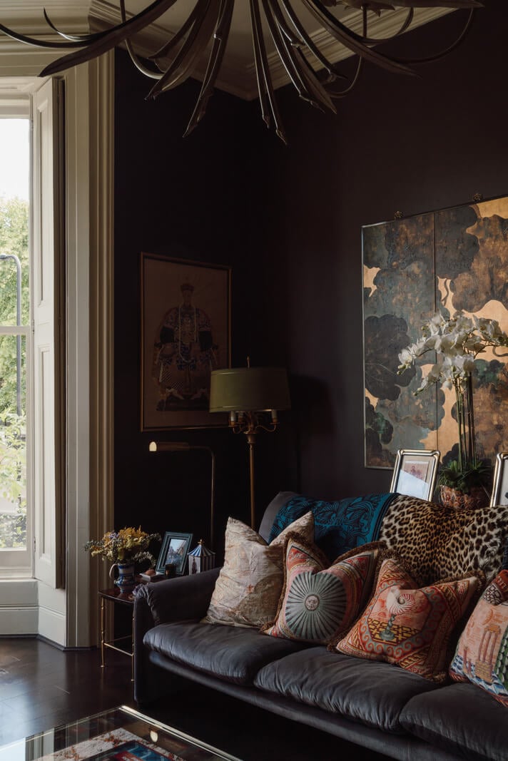 A Moody Color Palette and Eclectic Interiors in a London Apartment 3 moody living room high ceiling nordroom