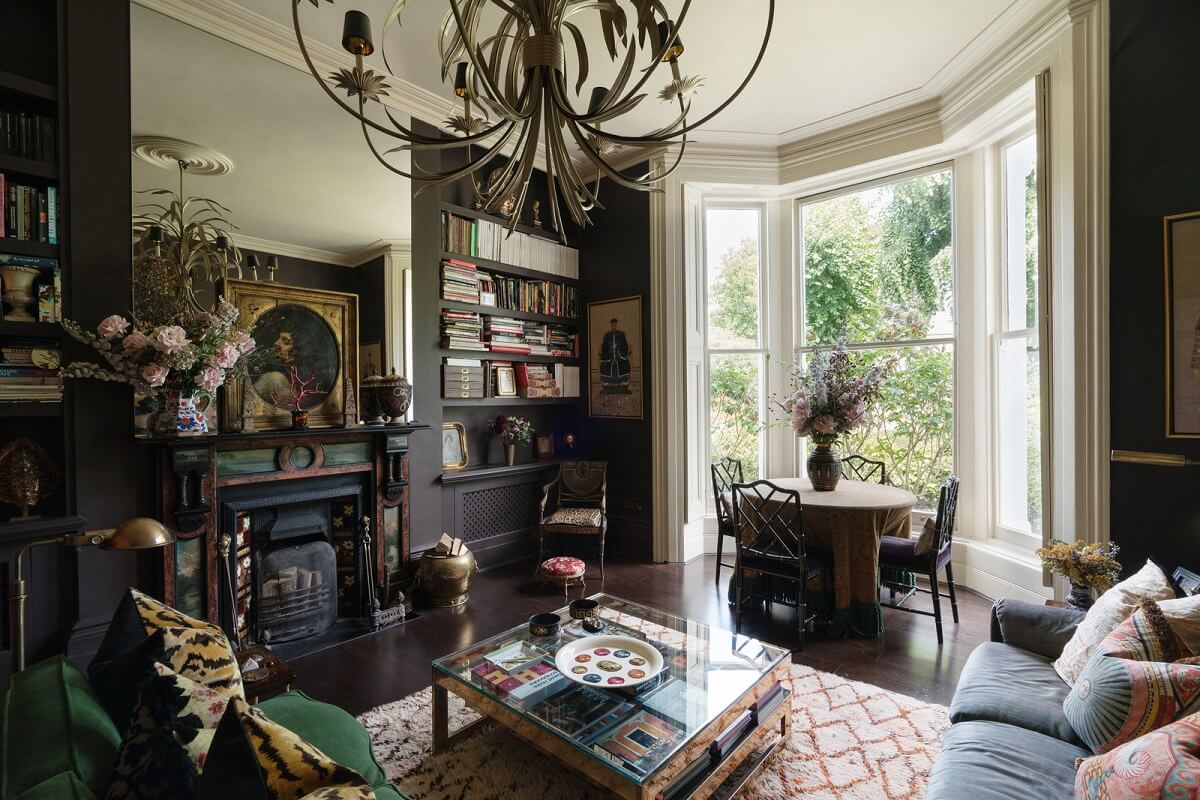Best of 2024: Living Rooms 17 moody living room with bay window fireplace with mirror nordroom
