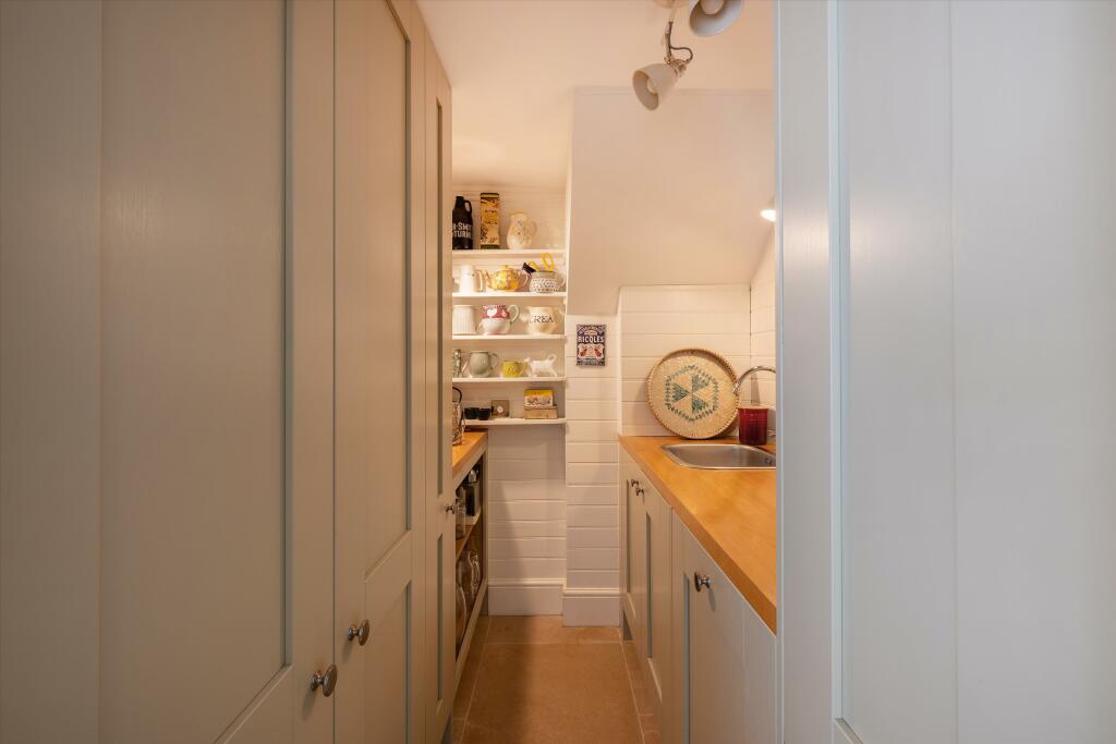 Cottage-style Interiors in a London Family Home 10 narrow utility room