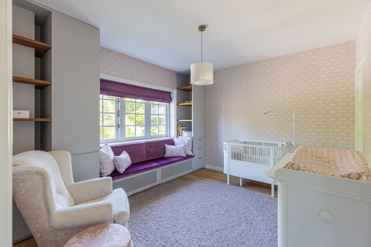 Bold Color Accents in a Dutch Family Home 18 nursery with purple window seat