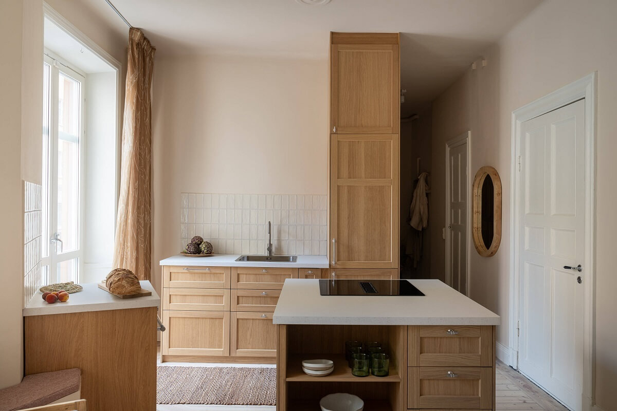 An Elegant Small Renovated Apartment in Stockholm 6 oak kitchen cabinets