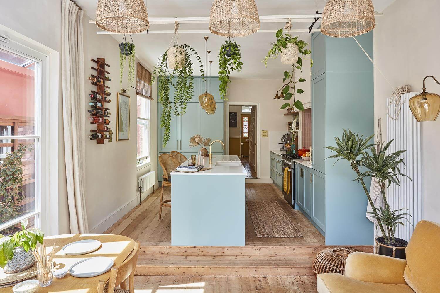 Playful Materials, Textures, and Colors in a London Home 8 open plan kichen living room with blue cabinets and wooden floor