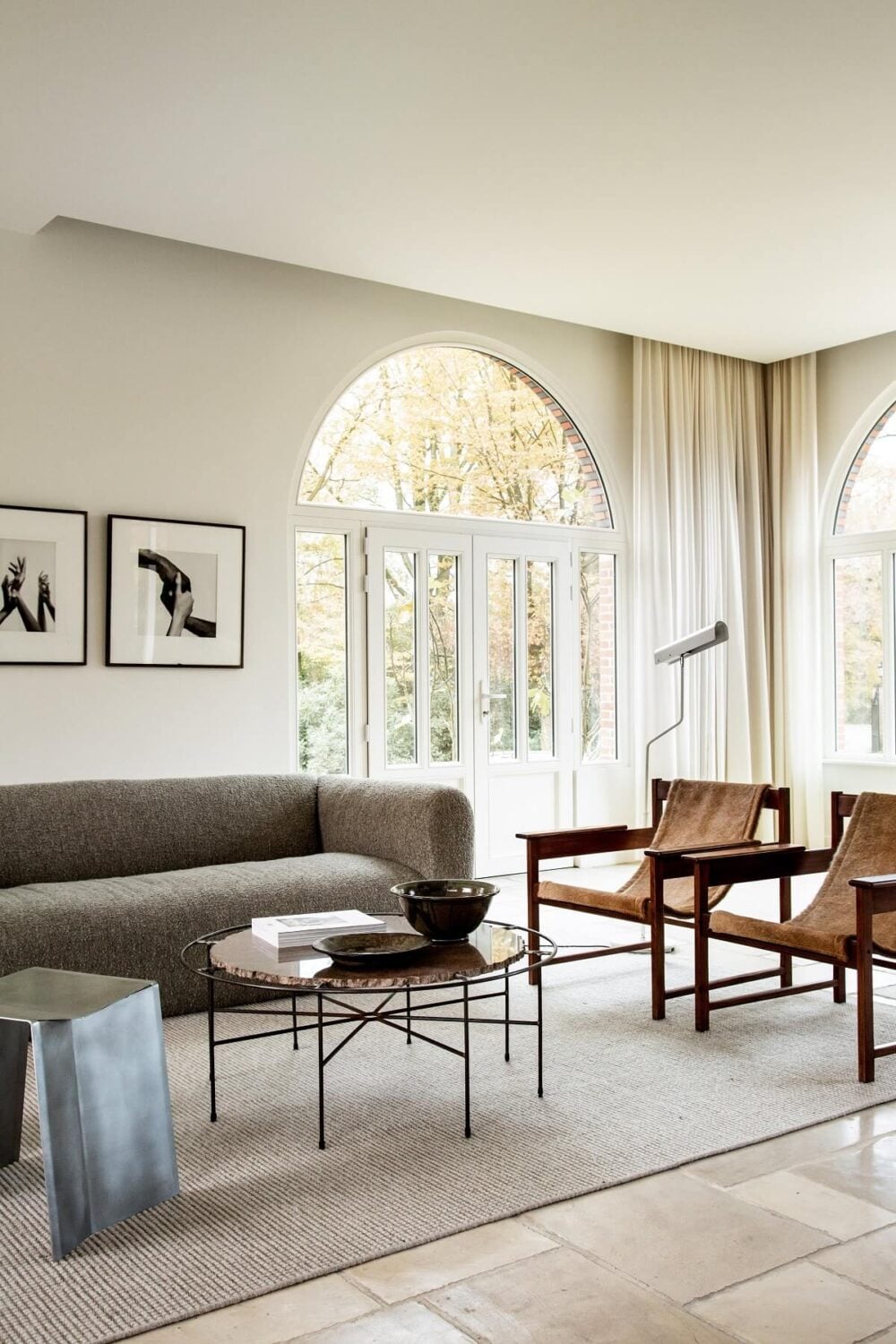 Historic Character and Timeless Elegant Interiors in a Restored Belgian Villa 2 open plan living room arched window avenue design studio