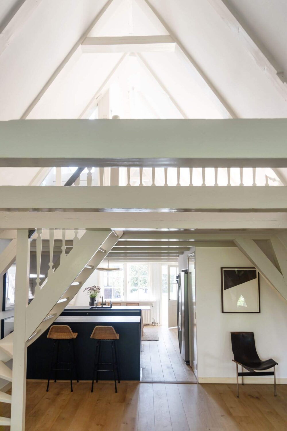 An Apartment with High Pitched Ceilings in an Amsterdam Canal House 6 open plan living room kitchen light space amsterdam apartment