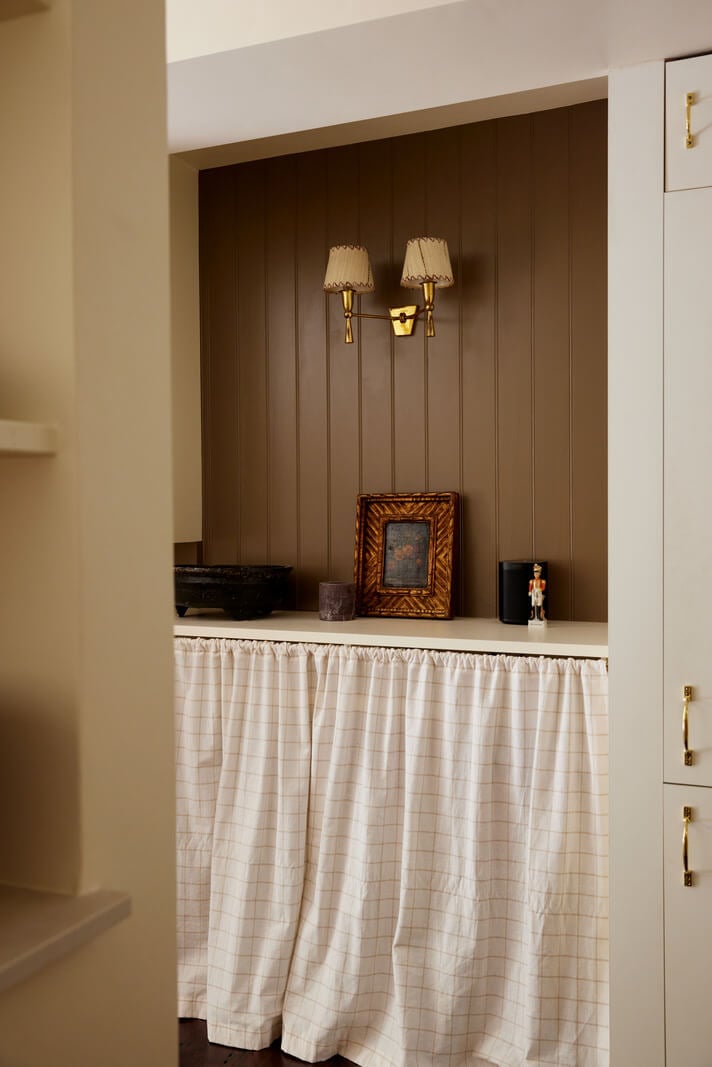 A Charming London House with an Ochre Yellow Bedroom 10 pantry with brown tongue and groove paneling