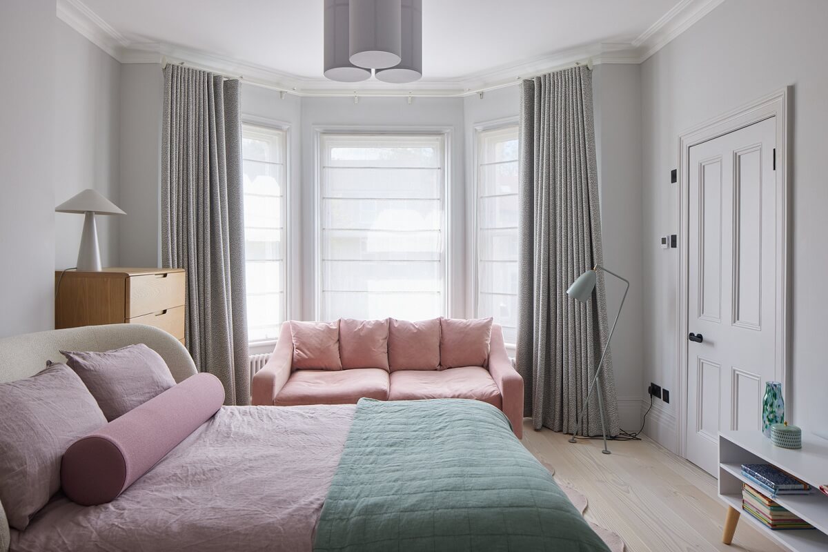 A London Family Home Decorated in Pastel Colors 20 pastel bedroom with bay window and sofa nordroom