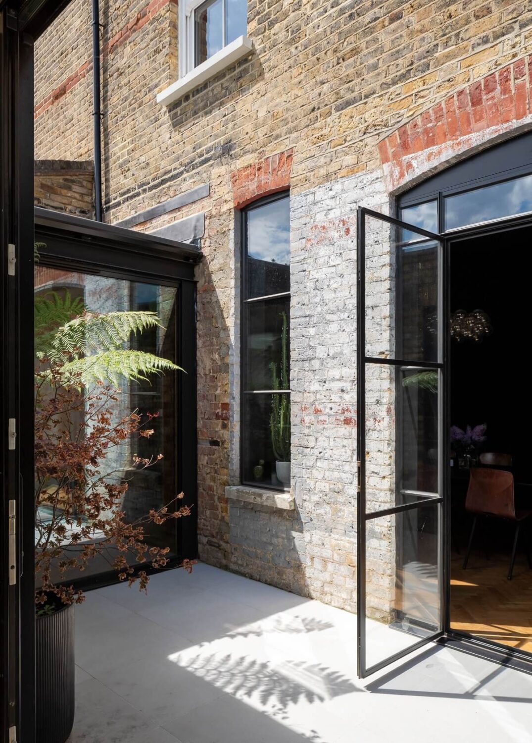 A Stunning Color Palette in an Extended Edwardian House in London 11 patio garden terrace