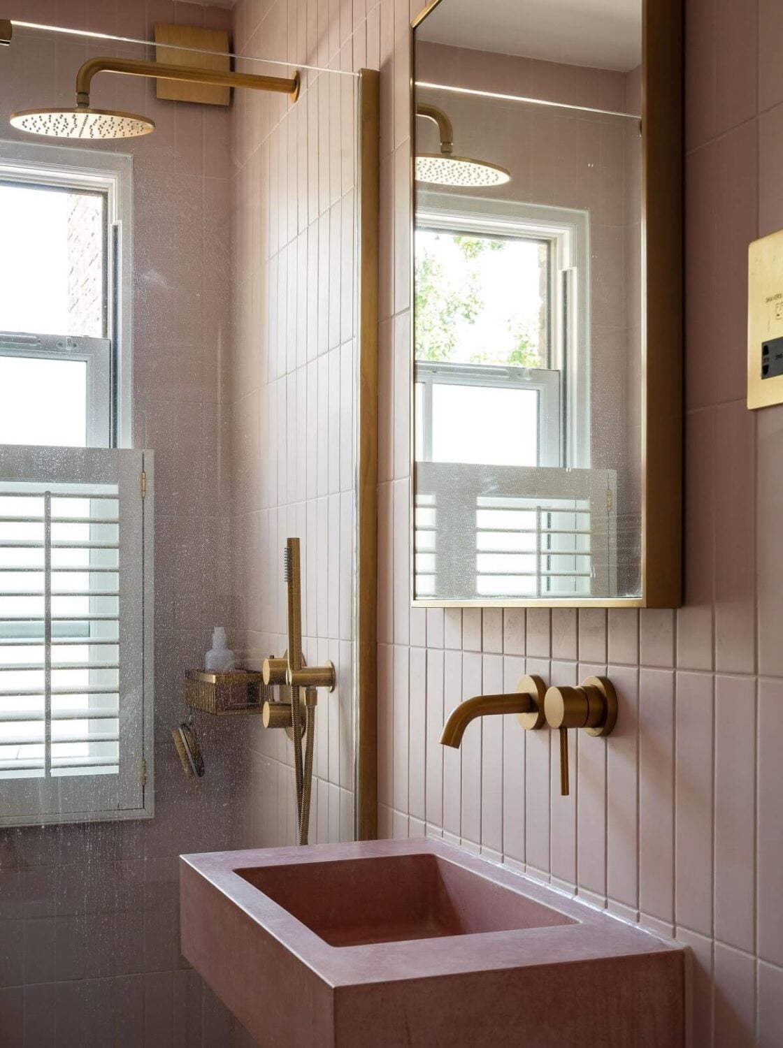 A Stunning Color Palette in an Extended Edwardian House in London 27 pink sink and brass fittings nordroom