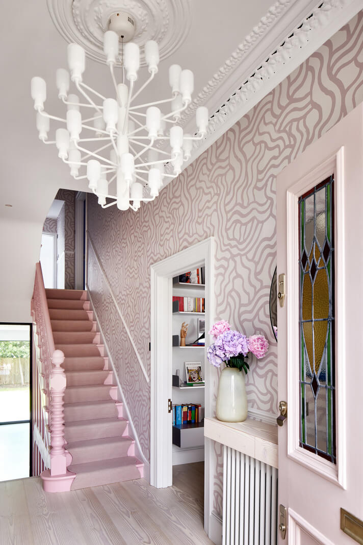 A London Family Home Decorated in Pastel Colors 14 pink tones hallway with wallpaper