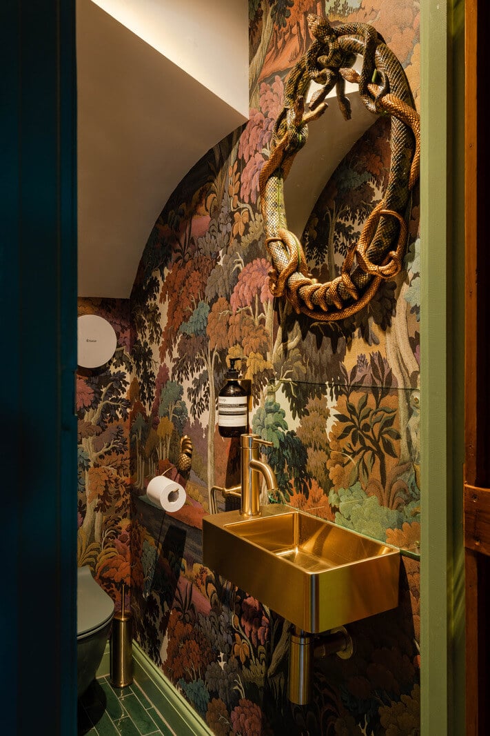 Exposed Materials and Green Tones in a London Stable Conversion 9 powder room with wallpaper