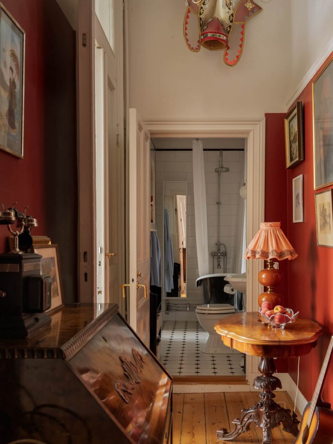 Antique Furniture and Arched Windows in a Stockholm Apartment 21 red hallway with antique furniture nordroom