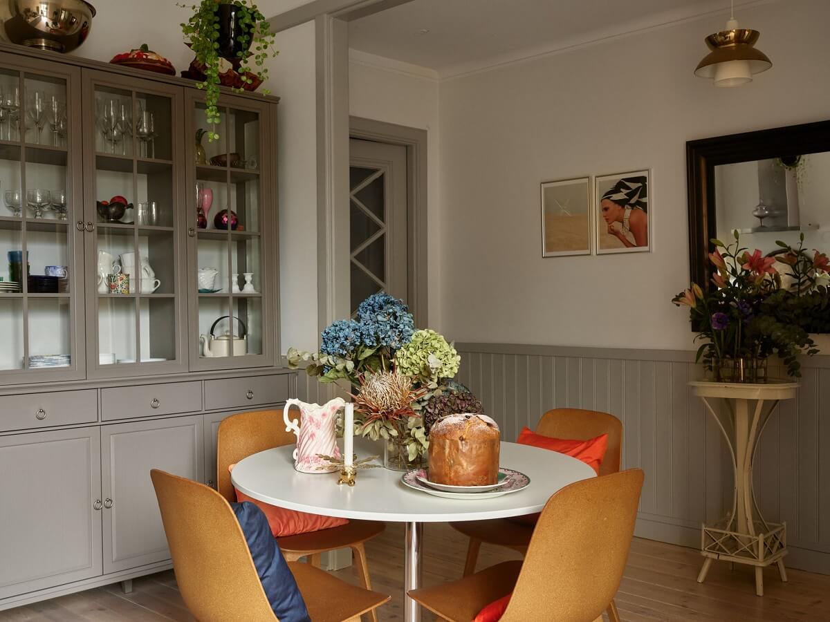 A Charming 1920s Apartment with a Green Bedroom 5 round dining table in gray kitchen