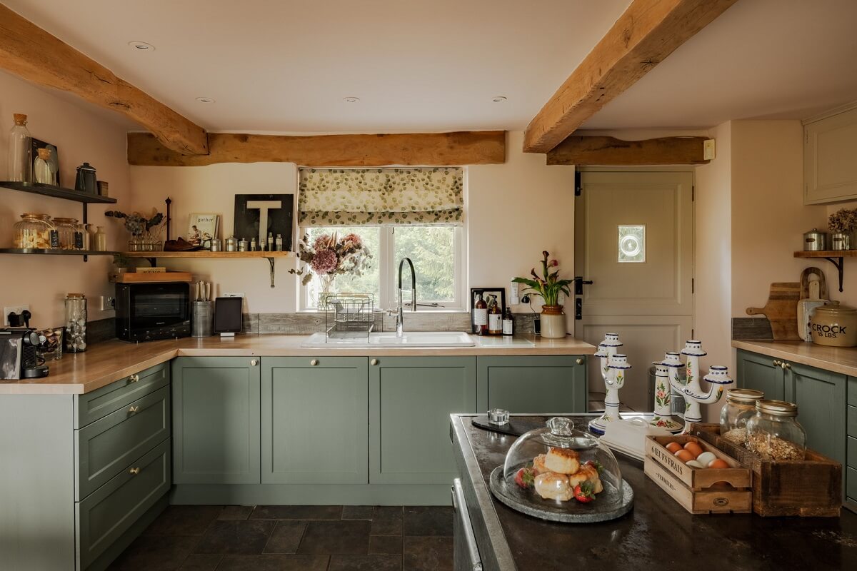 Valspar Color of the Year 2026: Warm Eucalyptus 8 sage green kitchen cabinets wooden beams