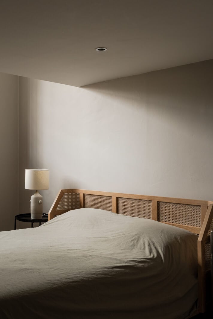 A London Loft in a Former Victorian School Building 9 serene bedroom wicker headboard A London Loft in a Former Victorian School Building