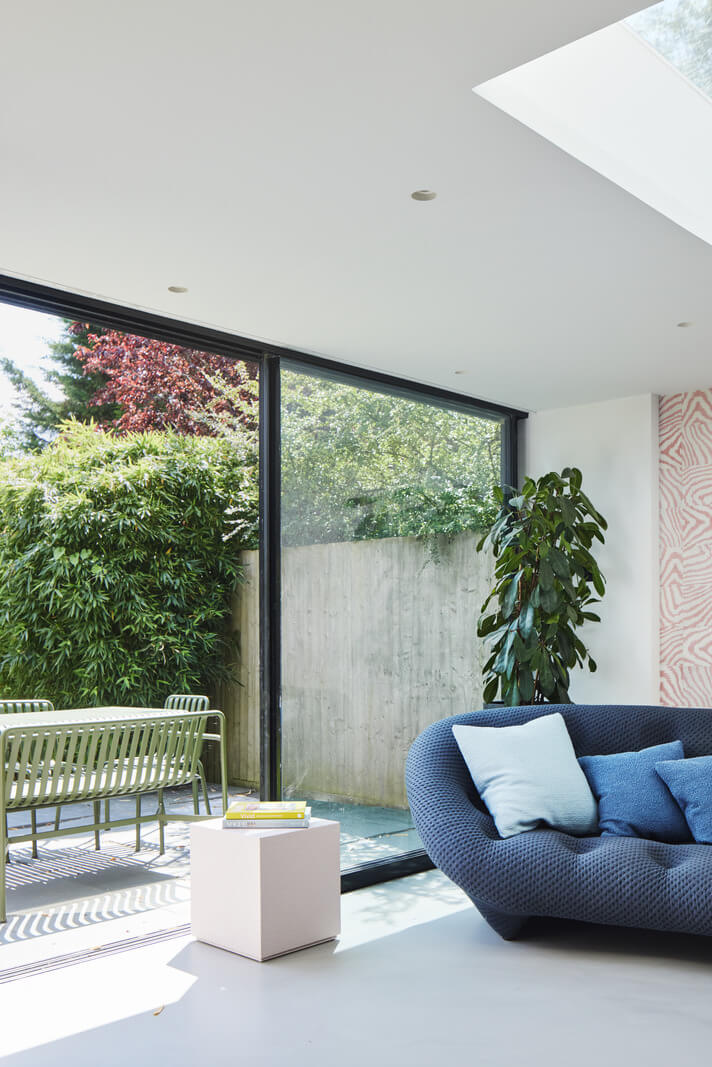 A London Family Home Decorated in Pastel Colors 5 sitting area with access to garden