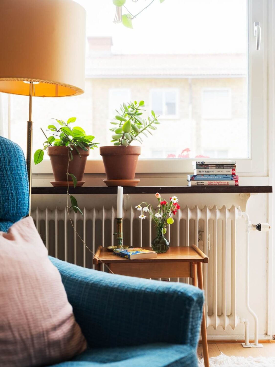 A Studio Apartment with Light Pink Walls and Vintage Furniture 11 sitting room detail