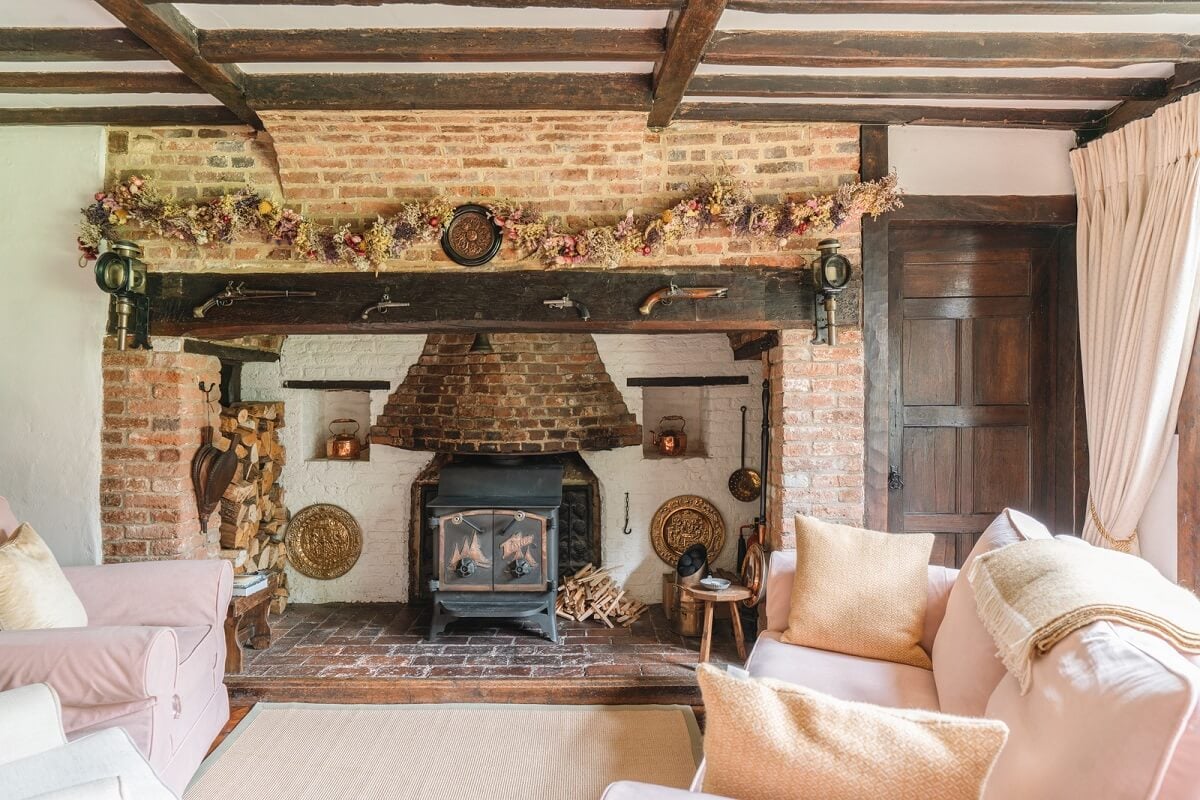 Magnificent Period Features in an English Tudor House 3 sitting room with brick fireplace